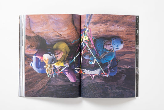 Angela Vanwiemeersch and Bronwyn Hodgins looking up at a big wall climb from a portaledge in Zion National Park, Utah.